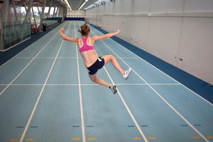 female athlete doing crazy star jump