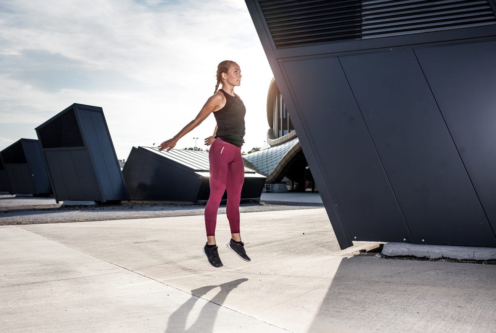 Female Athlete Stretching Outdoors