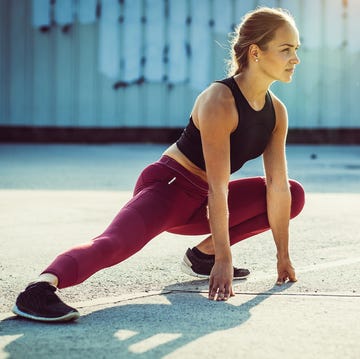 Female Athlete Stretching Outdoors