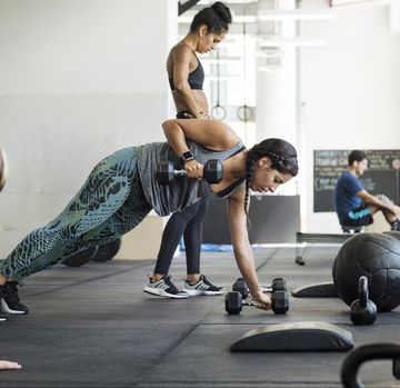 Female athletes doing crossfit training in crossfit gym