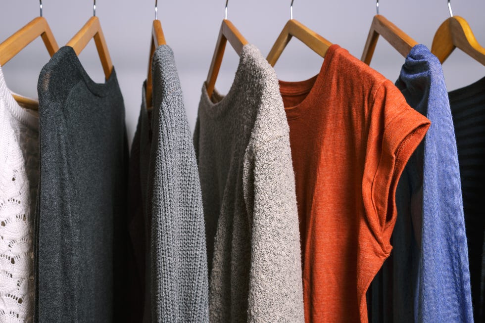Female clothes hanging on a clothing rack in a shop or home closet
