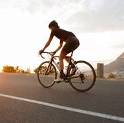 Female cyclist riding early in the morning