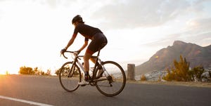 Female cyclist riding early in the morning