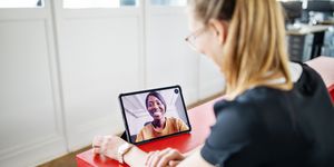 female executives having video call in office