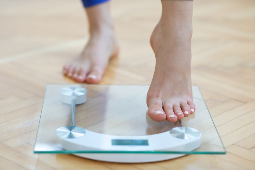 female feet weighing scale