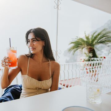 female friends enjoy a cocktail in an al fresco dining experience