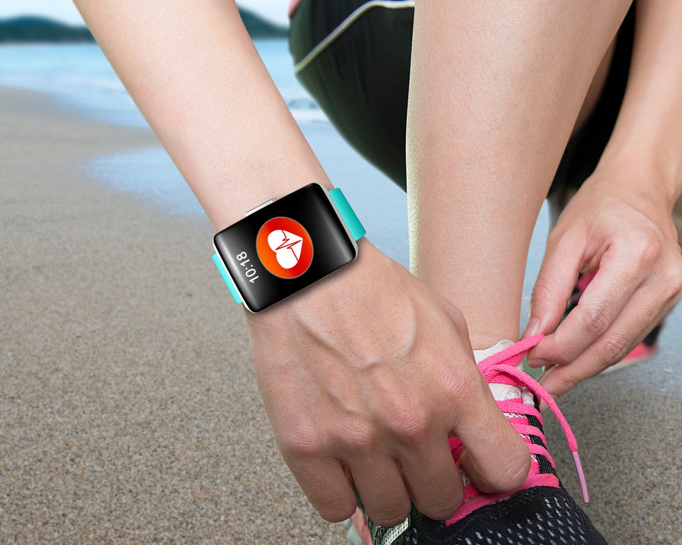 female hand tying shoelaces wearing bright green watchband touch