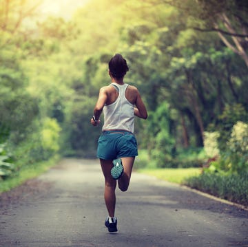 female runner running Lost at summer park trail  healthy fitness woman jogging outdoors