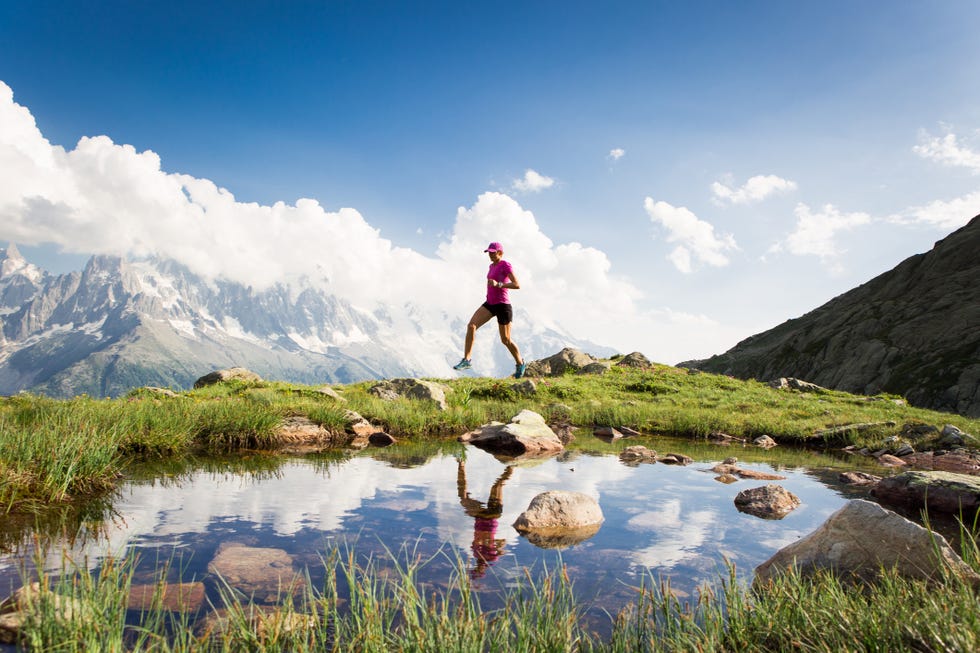 female running in the mountains