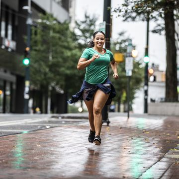 female running through urban area