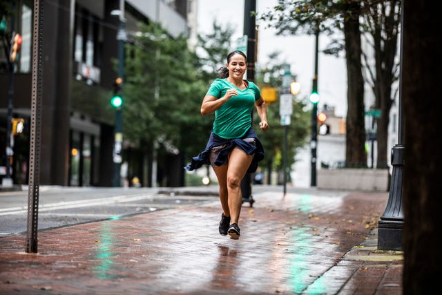 female running through urban area