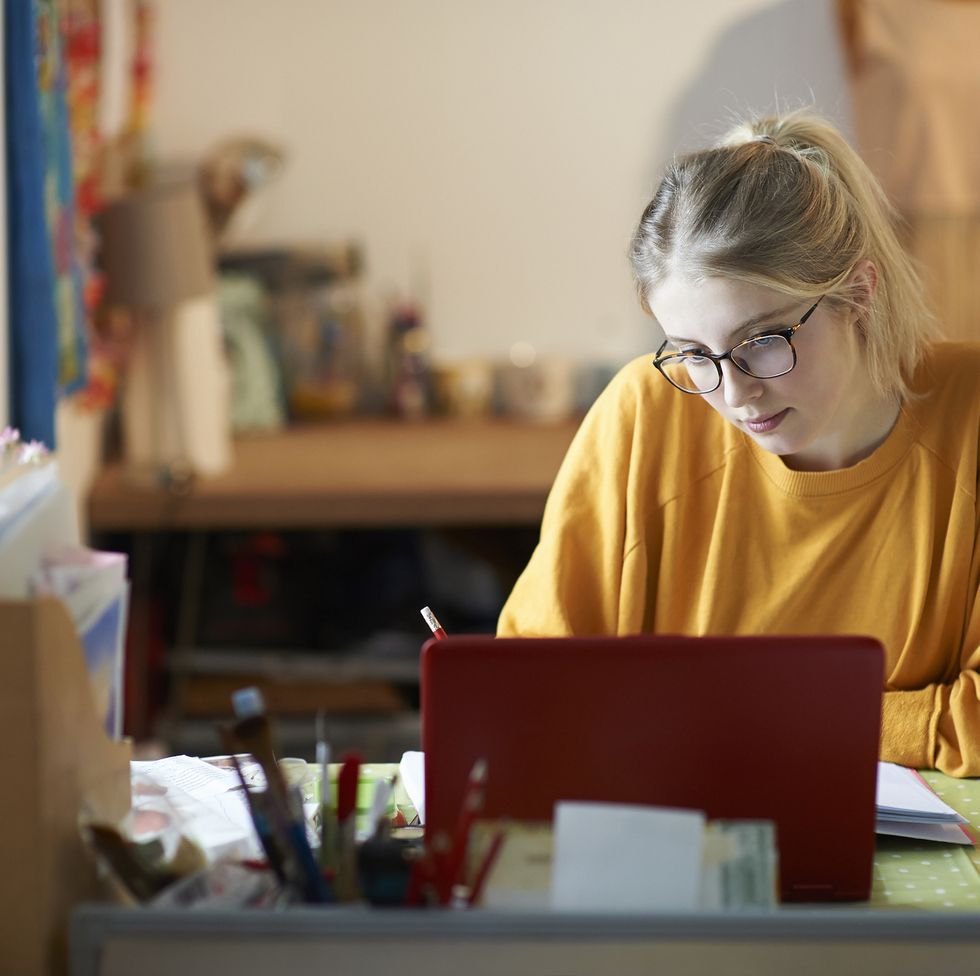 female student at home studying
