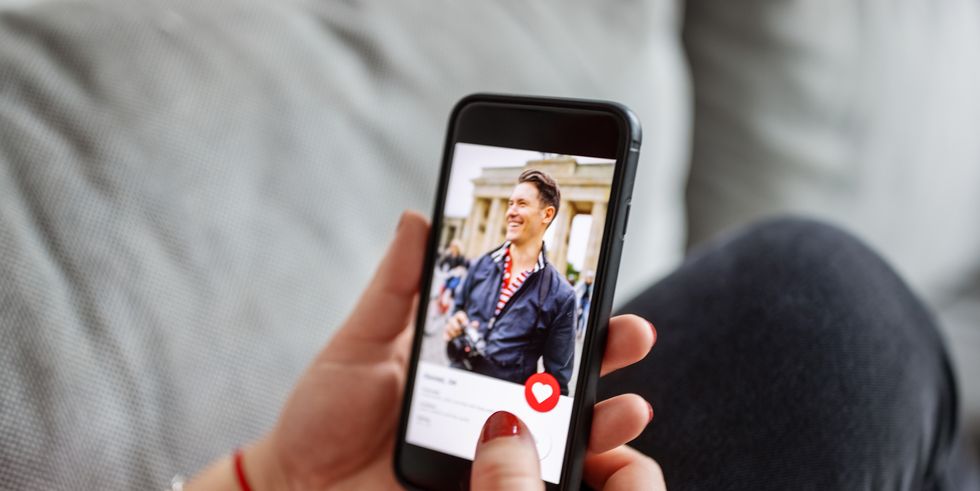 female using a dating app on smart phone