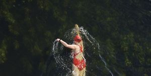 https://hips.hearstapps.com/hmg-prod/images/female-wild-swimmer-in-river-great-ouse-royalty-free-image-1689111512.jpg?crop=1.00xw:0.669xh;0,0.194xh&resize=300:*