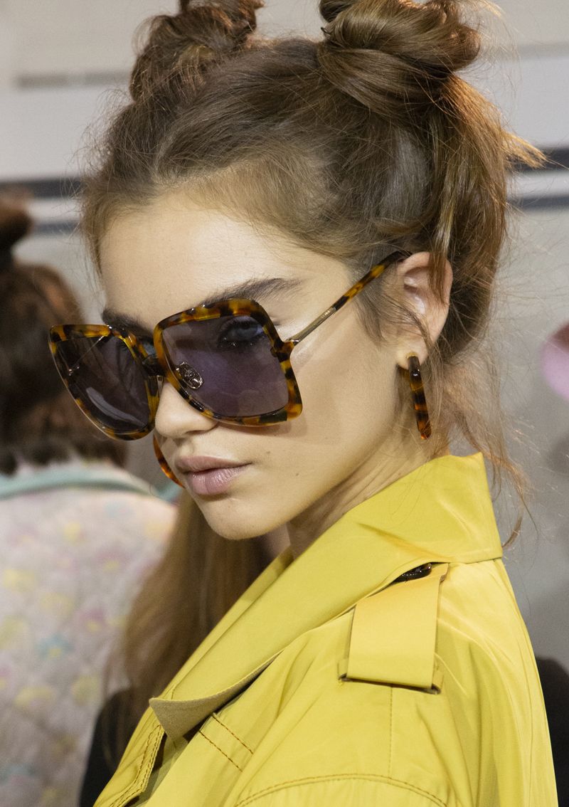Eyewear, Hair, Glasses, Ear, Vision care, Hairstyle, Yellow, Goggles, Earrings, Jacket, 