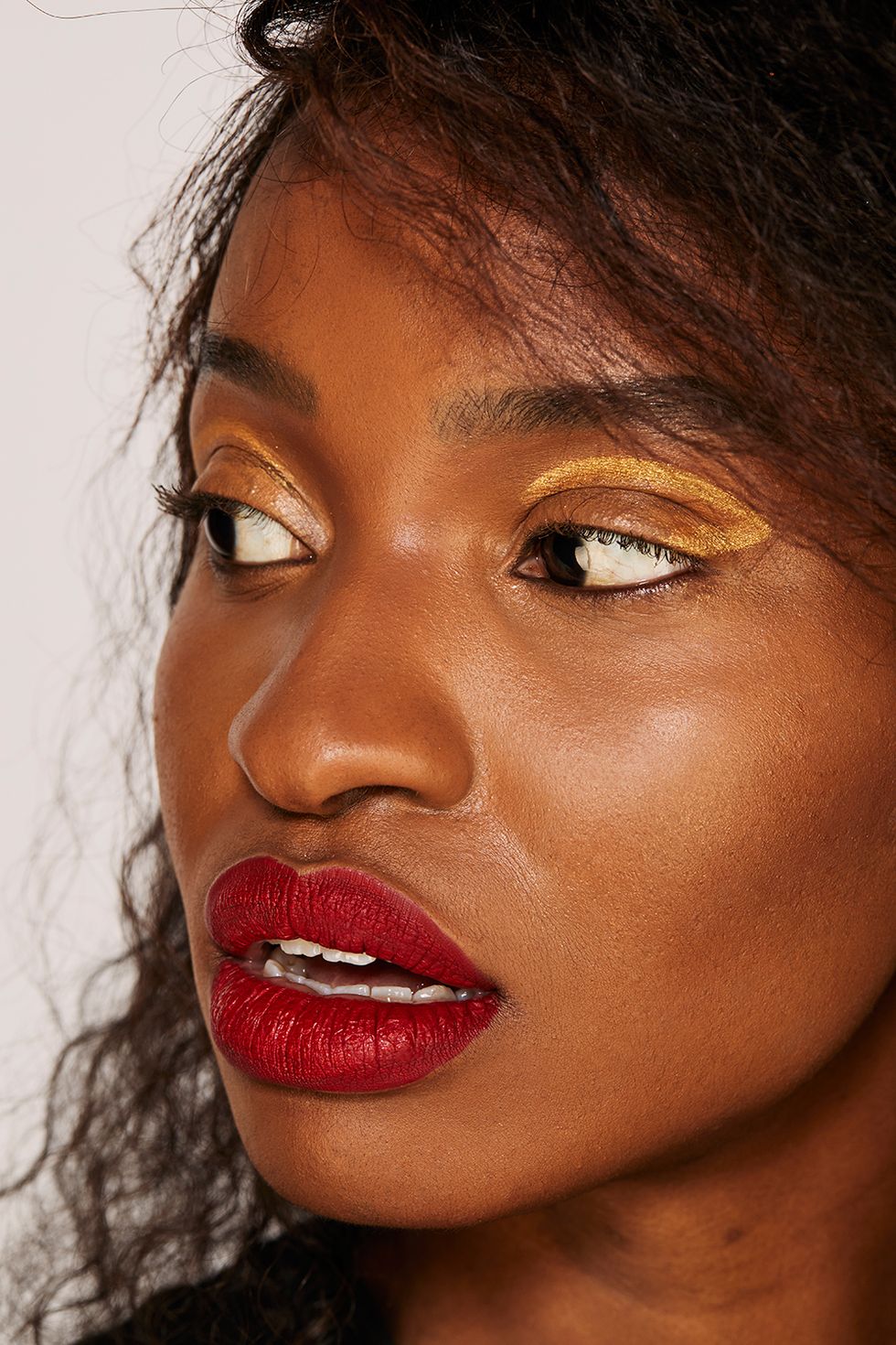 Red lips ideas for party season - Using Fenty Beauty Sunna