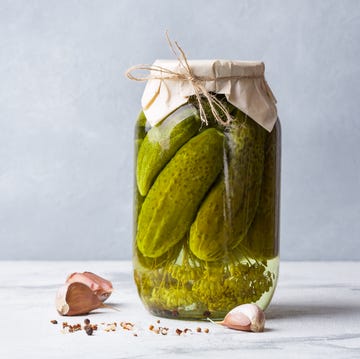 Fermenting cucumbers in glass jar. fermenting cucumbers in glass jar