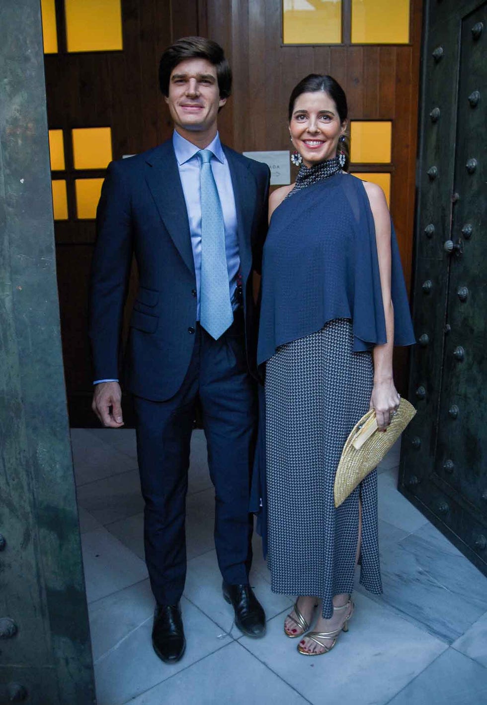a man and a woman standing in front of a door