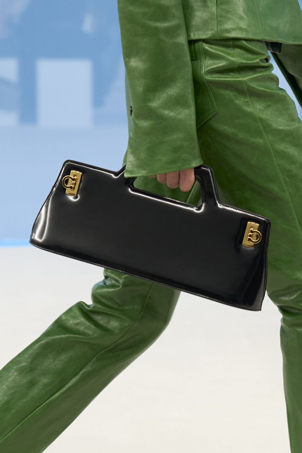 a person holding a black wallet