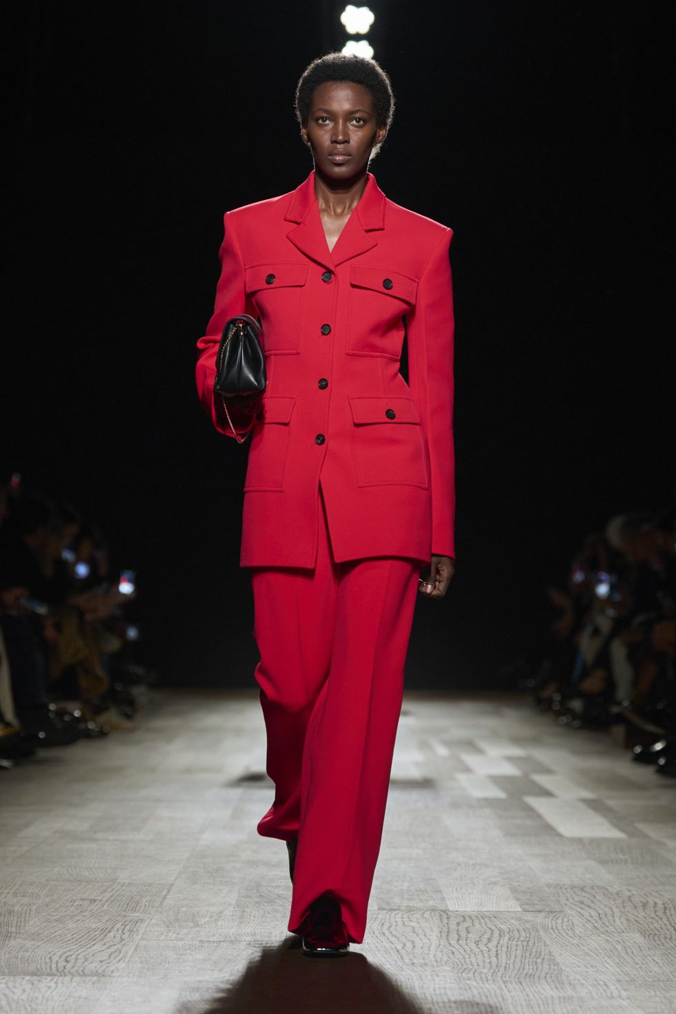 a man wearing a red suit