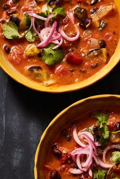 fiery black bean soup in yellow bowls