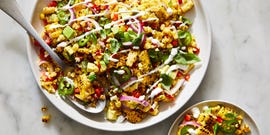 fiesta corn salad topped with crema