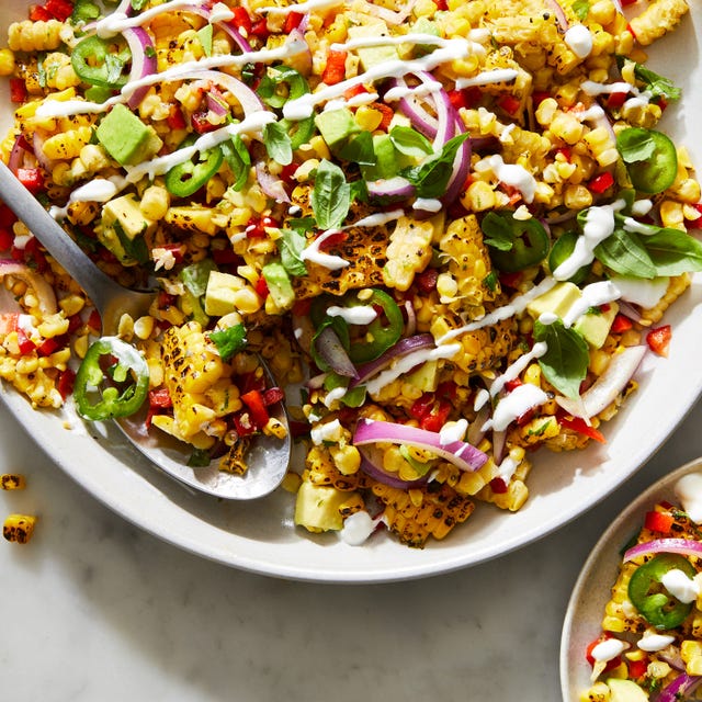 fiesta corn salad topped with crema