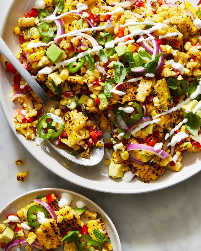 fiesta corn salad topped with crema