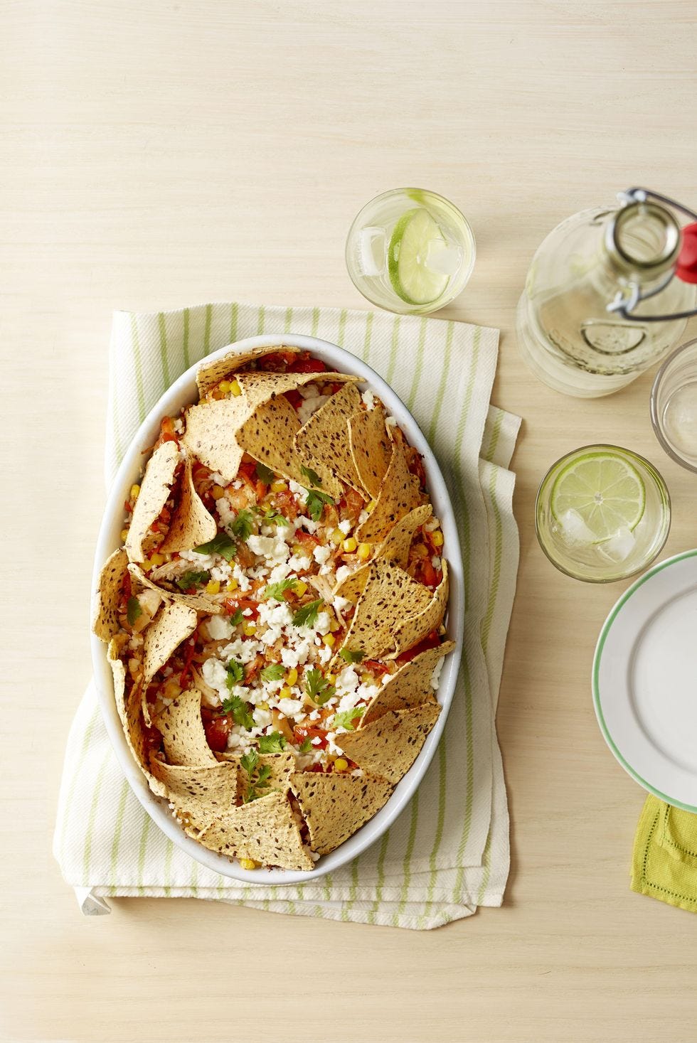 fiesta nacho casserole on green and white towel