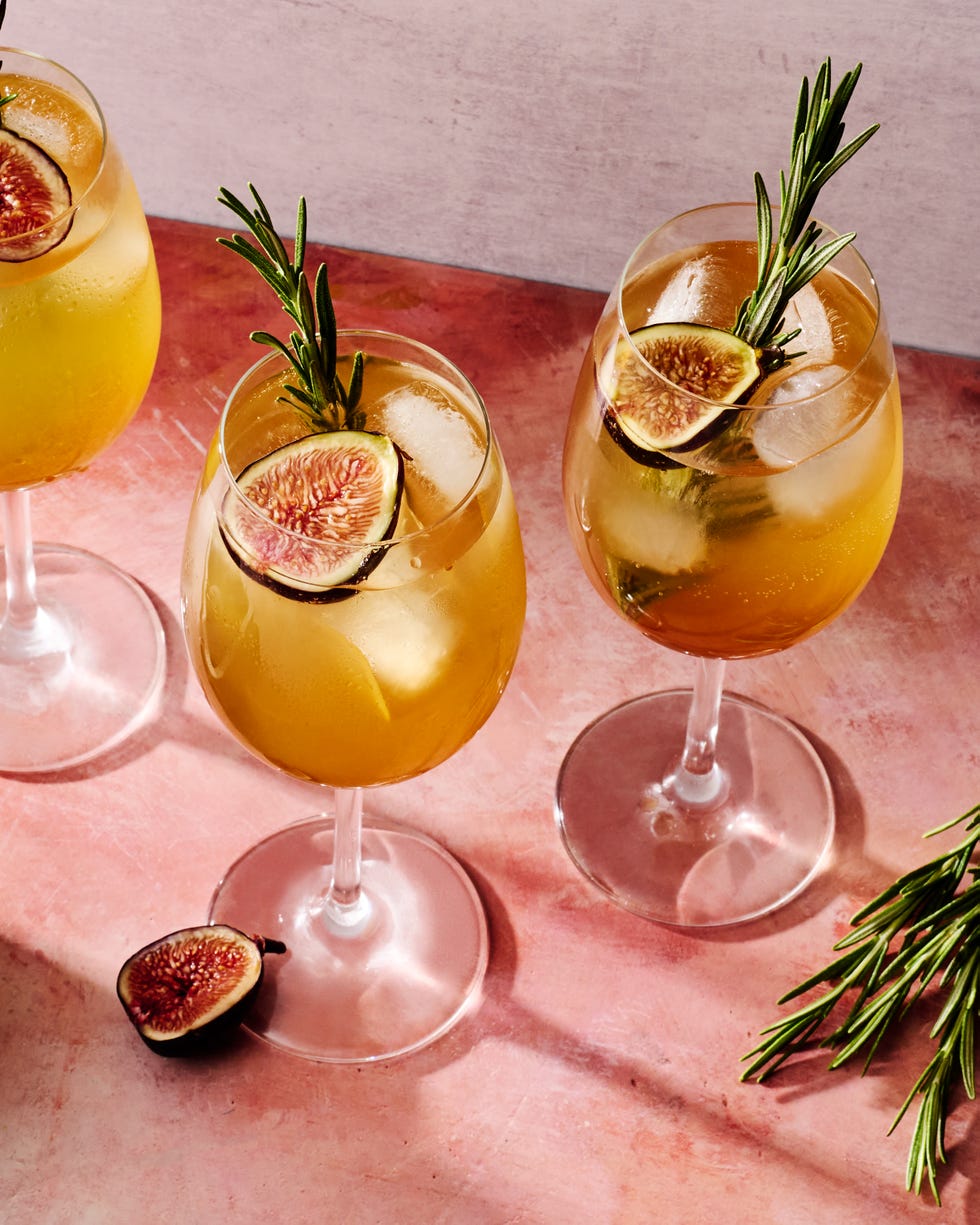 figgy spritz cocktail with a fig and rosemary garnish