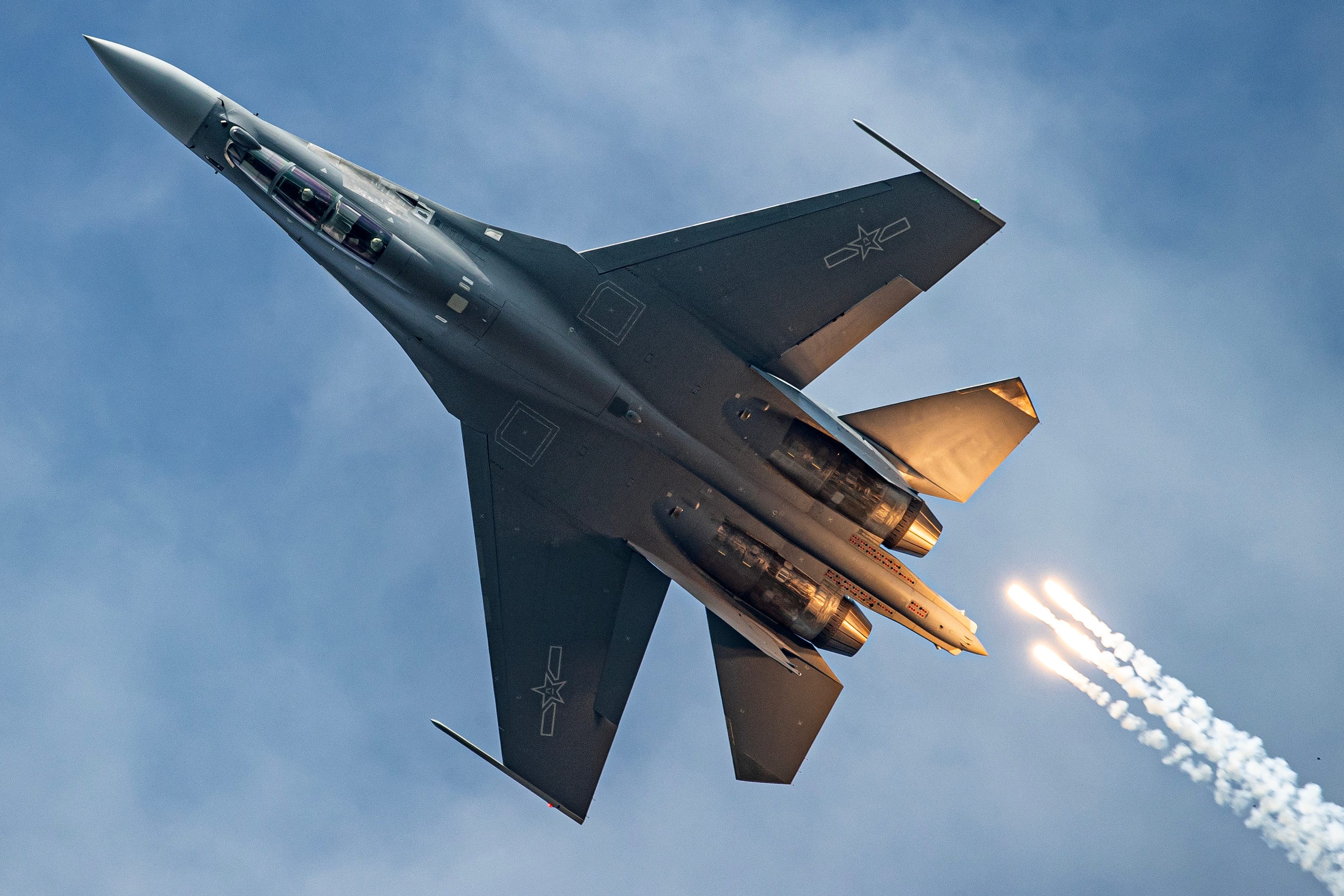 Fighter jet performs in the sky during the 14th China news photo