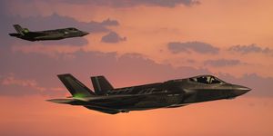 f 35 fıghter jets in flight at sunset