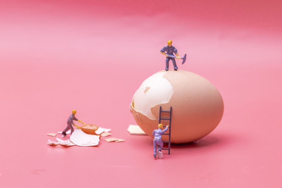 figurines work hard on the egg
