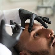filler injection for male face in beauty clinic