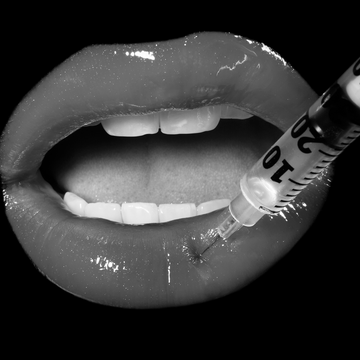 syringe being injected into lips