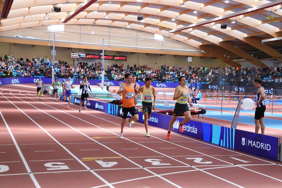 athletes competing on a track during a sporting event