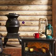 cabin scene with vintage stoves and lanterns