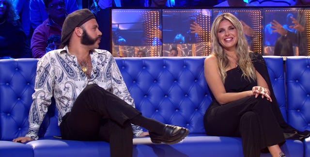 a man and woman sitting on a couch