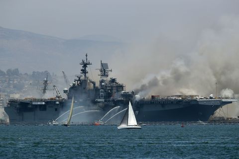 navy ship uss bonhomme richard burns at naval base in san diego