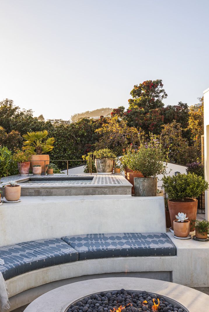 1920s spanish colonial in san francisco designed by regan baker design and landscape architect terremoto roof deck all three firms, medium plenty, terremoto, and regan baker interiors, came together to mastermind this bonus entertaining space, complete with a hot tub, fire pit, and herb garden bench cushions jovinas upholstery, in peter dunham textiles fabric flooring custom marble, stone fleury