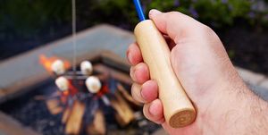 camping fire fishing rod
