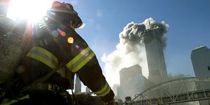 Firefighters walk towards one of the towers at the World Trade Center before it collapsed on September 11, 2001.