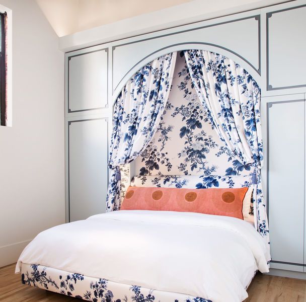 bed with blue and white chintz canopy
