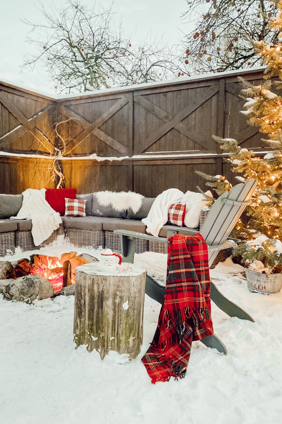 an outdoor space in the winter decorated with holiday decor