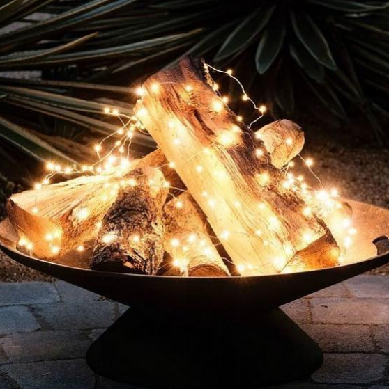 Fairy Lights Add Sparkle to a Fire Pit