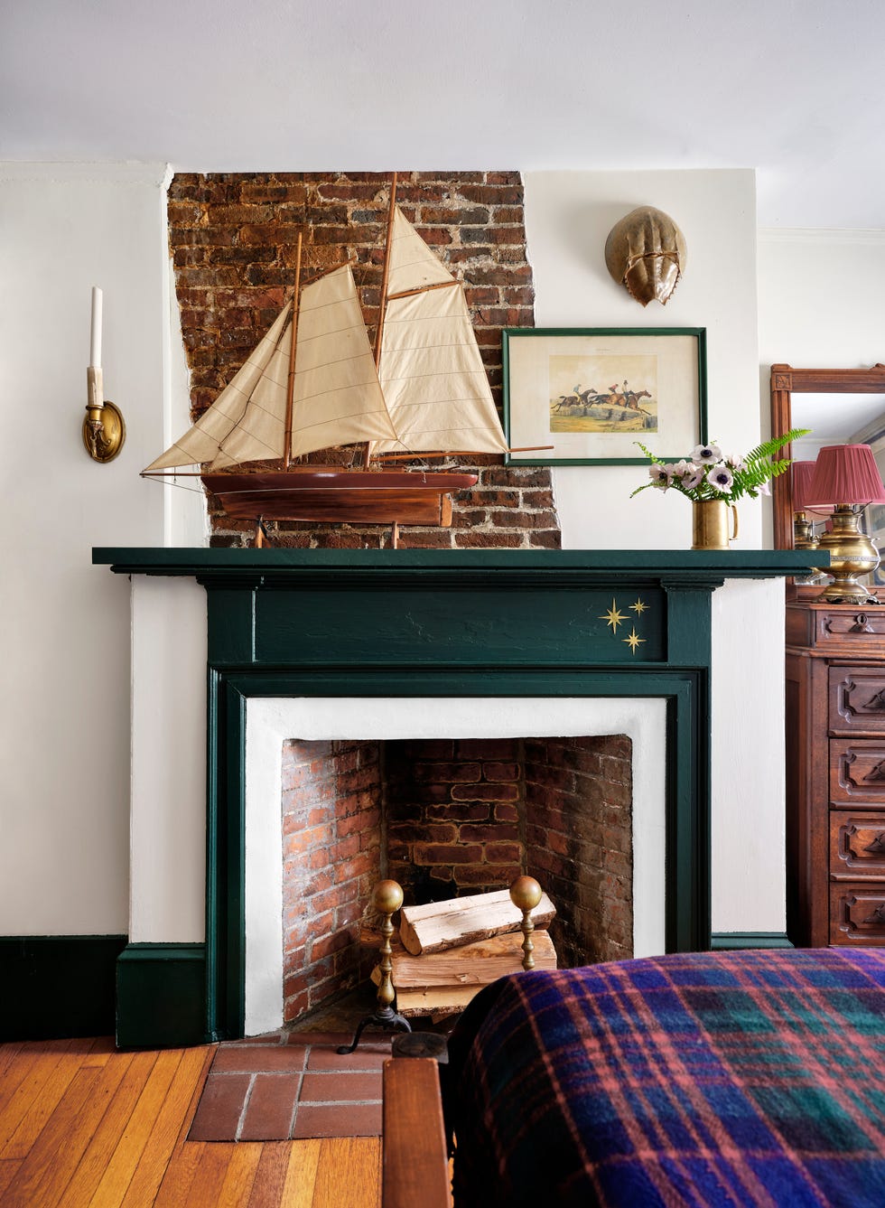 bedroom with a dark green fireplace mantel