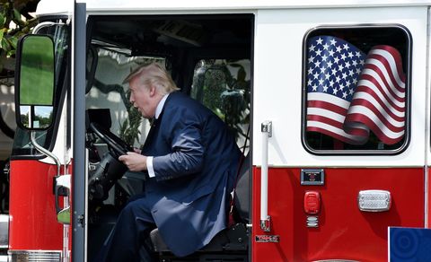 president donald trump examines a fire truck from wisconsin based manufacturer pierce on the south lawn during a "made in america" product showcase event at the white house in washington, dc, on july 17, 2017   afp photo  olivier douliery        photo credit should read olivier doulieryafp via getty images