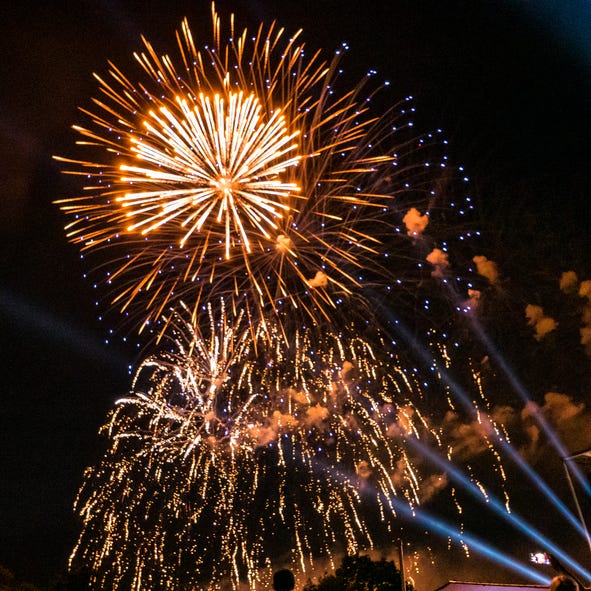 gold and blue fireworks explode
