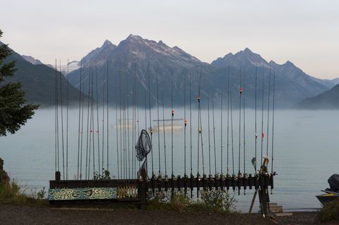 Fishing rods on the beach at Redoubt Mountain Lodge on Lake...