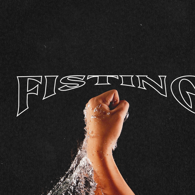 a fist emerging out of water
